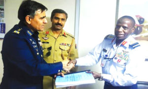 ABUJA: Air Marshal Arshad Malik, chairman Pakistan Aeronautical Complex handing over the Super Mushshak  sale contract to Air Vice Marshal Iya Ahmed Abdullahi of Nigerian Air Force (NAF).