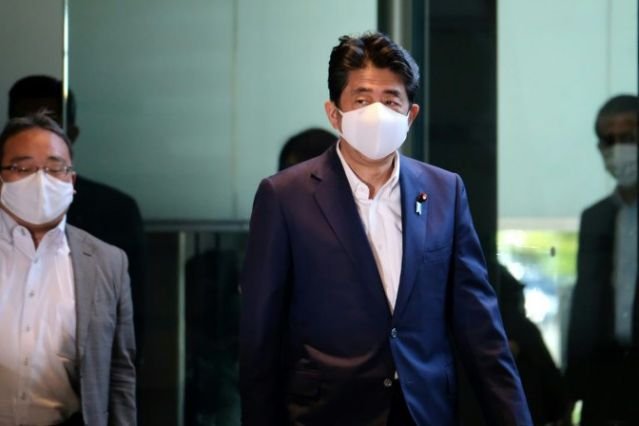 Read more about the article Japan PM returns to hospital as he breaks term record