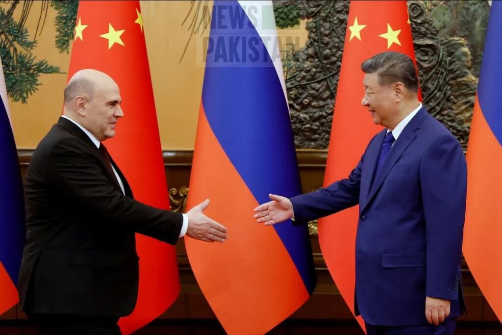 President of China Xi Jinping seen welcoming the Russian PM